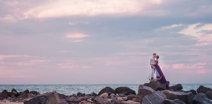 young-romantic-couple-relaxing-beach-watching-sunset-2